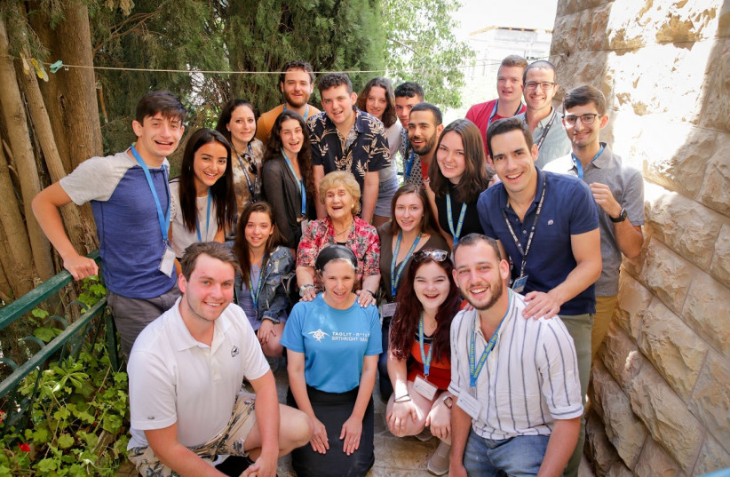  RENA QUINT (C) with a Taglit-Birthright group.  (photo credit: YONIT SCHILLER)