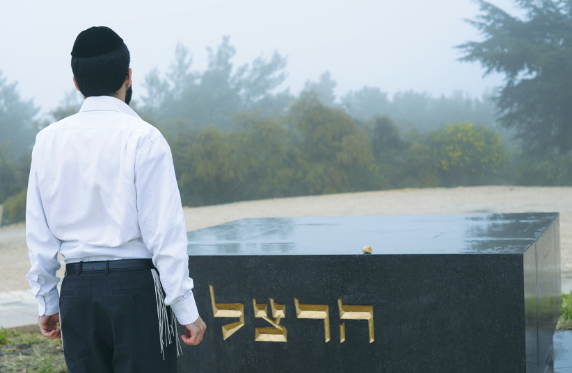  A HAREDI man pays his respects at the grave of Theodor Herzl on Mount Herzl in Jerusalem. (photo credit: ZUZANA JANKU/FLASH 90)