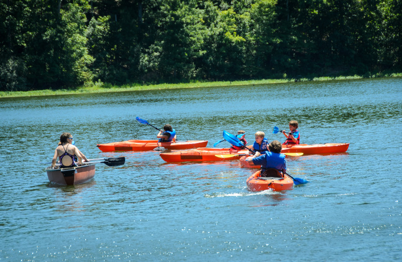  Campers at Camp Indigo Point will participate in traditional camp activities such as canoeing, and will also have special programming catered to LGBTQ community-building. (credit: DAN GRABEL)