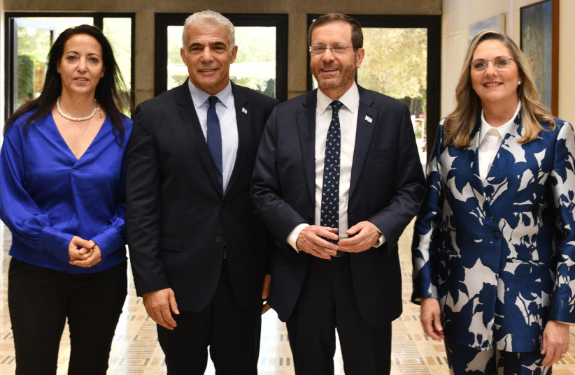  FROM LEFT: Lihi Lapid, Foreign Minister Yair Lapid, President Isaac Herzog, Michal Herzog (photo credit: CHAIM TZACH/GPO)