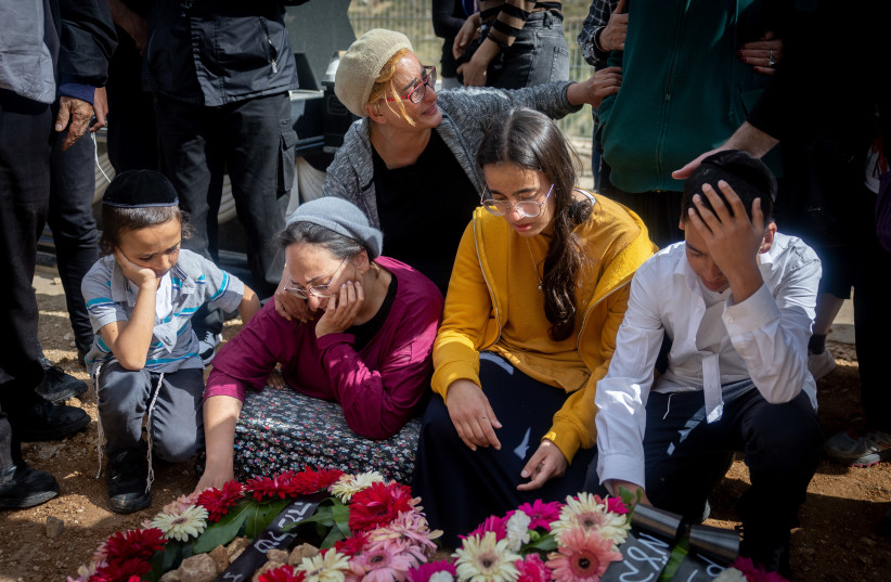  Family and friends grieve at the funeral of Boaz Gol in Jerusalem, Gol was killed Thursday night in a terror attack in Elad (photo credit: YONATAN SINDEL/FLASH90)