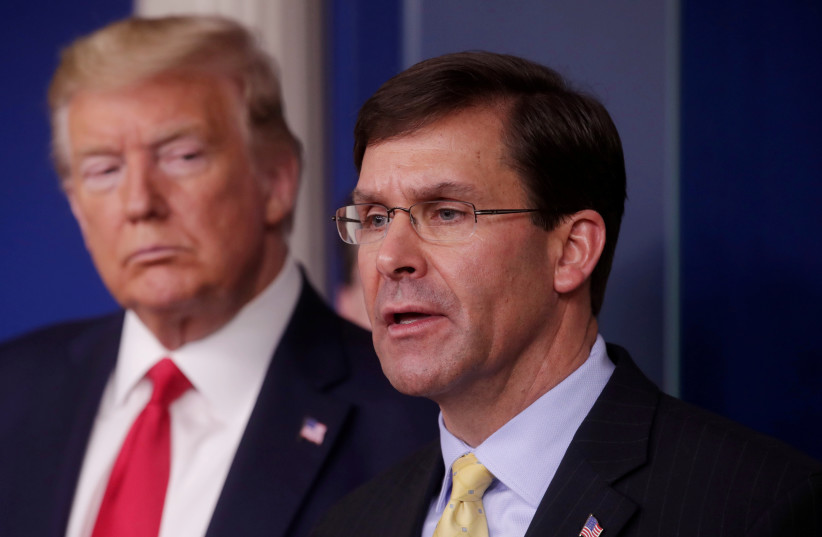  Former US president Donald Trump listens to former Secretary of Defense Mark Esper address the daily White House coronavirus response briefing with members of the administration's coronavirus task force at the White House in Washington, US, March 18, 2020.  (photo credit: REUTERS / JONATHAN ERNST)