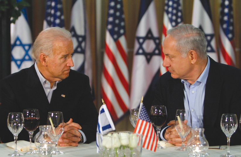  US PRESIDENT Joe Biden, at the time serving as vice president, has dinner with then-prime minister Benjamin Netanyahu in Jerusalem, during his visit to Israel in 2010.  (photo credit: MIRIAM ALSTER/FLASH90)