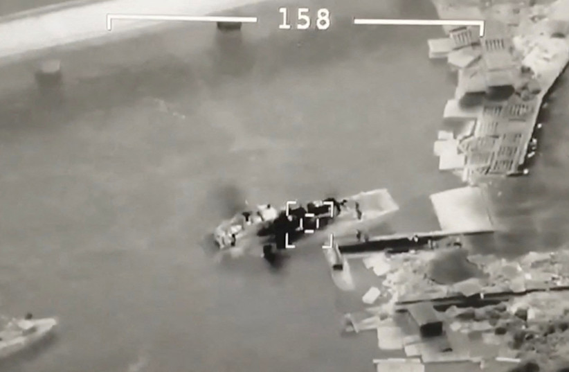  An aerial view shows Ukrainian UAV Bayraktar targeting Russian landing craft vessel at Zmiinyi (Snake) Island, Ukraine, in this still image from a handout video released by Press service of Ukrainian Ground Forces on May 7, 2022.  (credit: Ukrainian Ground Forces/Handout via REUTERS)