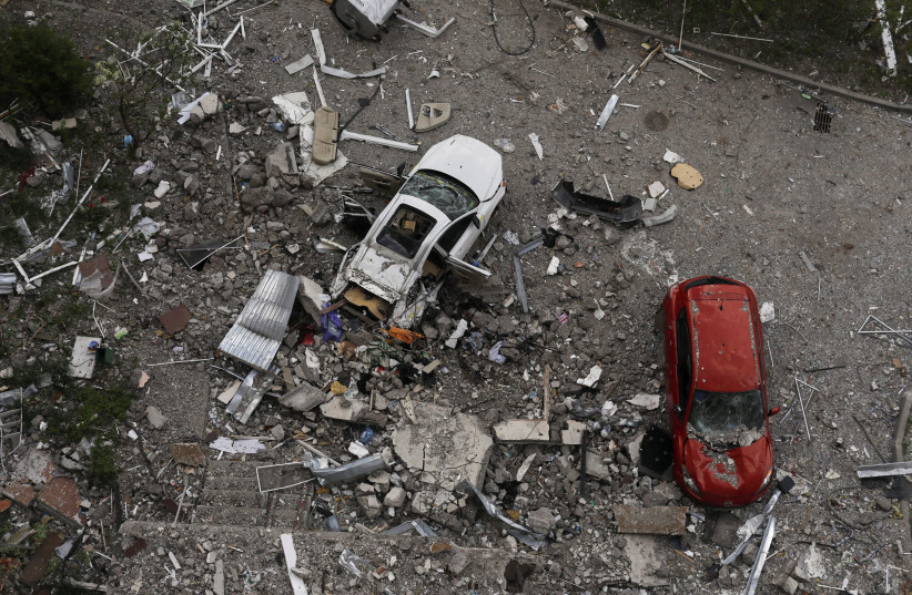  Damaged cars are pictured on debris of a damaged residencial building in Saltivka neighbourhood, amid Russia's attack on Ukraine, in Kharkiv, Ukraine, May 10, 2022.  (credit: REUTERS/RICARDO MORAES)