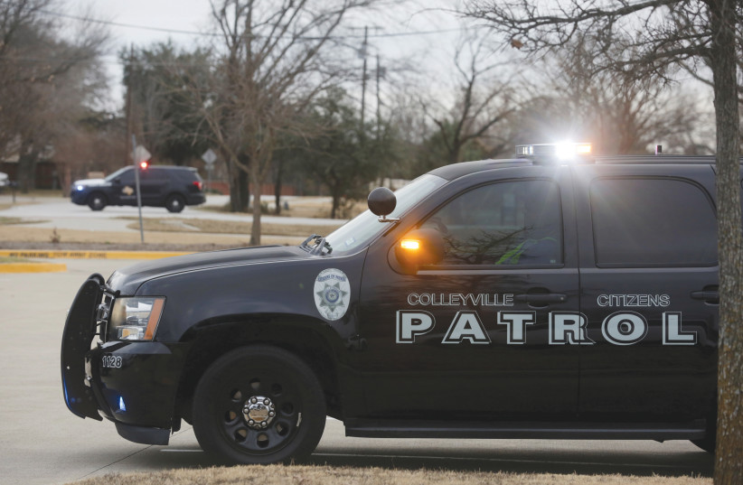 Law enforcement vehicles are posted near a synagogue in Colleyville, Texas, during a hostage-taking incident, in January. (Shelby Tauber/Reuters) (photo credit: Shelby Tauber/Reuters)