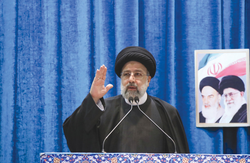 Iranian President Ebrahim Raisi speaks in Tehran on the occasion of the 43rd anniversary of the Islamic Revolution, in February. Built into the DNA of the Iranian Revolution from its start in 1979, is the aim of destroying Israel.  (photo credit: PRESIDENT WEBSITE/WANA (WEST ASIA NEWS AGENCY)/HANDOUT VIA REUTERS)