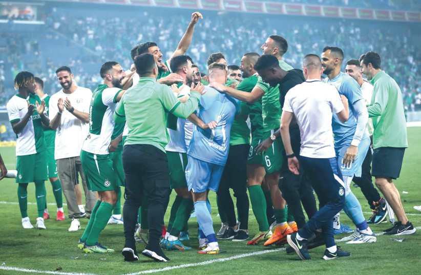  MACCABI TEL AVIV may have won the game on Tuesday night at Sammy Ofer Stadium, but it was host Maccabi Haifa that secured the league title. (photo credit: MAOR ELKASLASI)