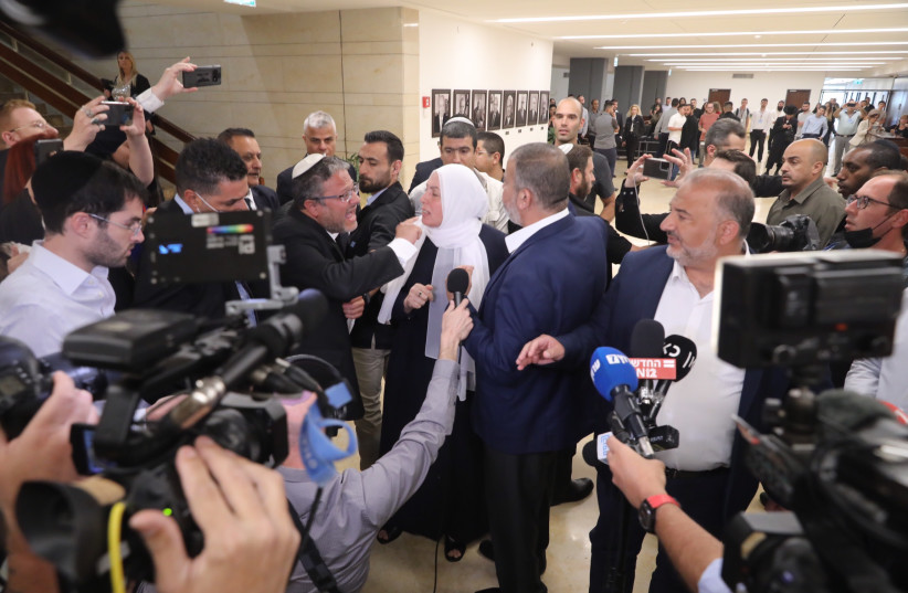  Religious Zionist Party MK Itamar Ben Gvir clashing with Ra'am head Mansour Abbas as Abbas announced he won't be voting for the dissolution of the Knesset, May 11, 2022.  (credit: MARC ISRAEL SELLEM/THE JERUSALEM POST)