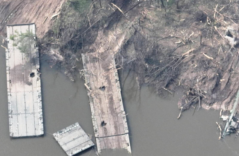  An aerial view of the remains of what appears to be a makeshift bridge across the Siverskyi Donets River, eastern Ukraine, in this handout image uploaded on May 12, 2022.  (photo credit: UKRAINIAN AIRBORNE FORCES COMMAND/HANDOUT VIA REUTERS)
