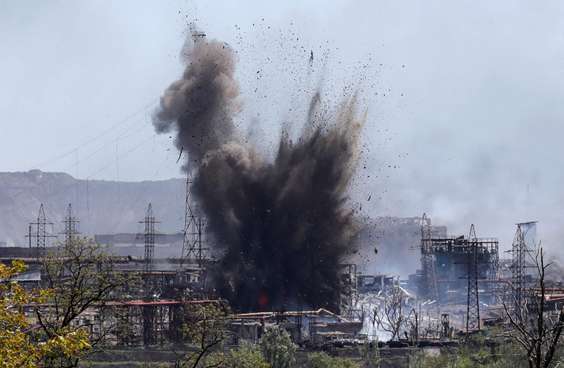  A view shows an explosion at a plant of Azovstal Iron and Steel Works during Ukraine-Russia conflict in the southern port city of Mariupol, Ukraine May 11, 2022. (photo credit: REUTERS/ALEXANDER ERMOCHENKO)