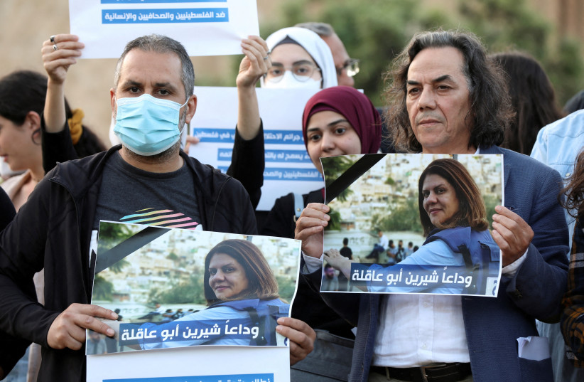  Lebanese journalists hold pictures of Al Jazeera reporter Shireen Abu Akleh, who was killed during a live fire exchange between Palestinians and IDF in Jenin, to express solidarity, in front of the UN building in Beirut, Lebanon May 11, 2022. (photo credit: REUTERS/MOHAMED AZAKIR)