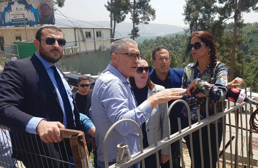  MERON 2022 project manager Brig.-Gen. (res.) and Israel Police Asst.-Ch. (ret.) Tzviki Tessler (center) gestures to (from left) MK Yomtob Kalfon, Jewish Religious Services Committee head MK Yulia Malinovsky, MK Moshe Tur-Paz and Public Security Committee head MK Merav Ben Ari, during a tour of the  (credit: MOSHE MIZRAHI)