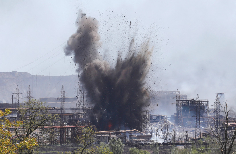 A blast this week in the southern port city of Mariupol in Ukraine. (photo credit: Alexander Ermochenko/Reuters)
