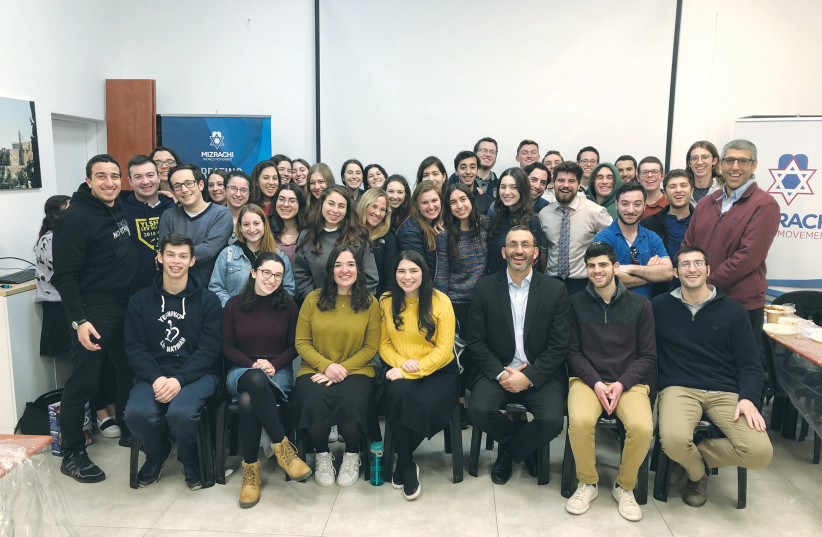  THE WRITER (seated in the front, third from right) meets with gap year students from abroad, at World Mizrachi Headquarters in Jerusalem. (photo credit: WORLD MIZRACHI)