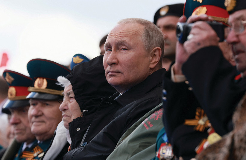  RUSSIAN PRESIDENT Vladimir Putin watches a military parade in Moscow’s Red Square on Victory Day, May 9, marking the anniversary of the victory over Nazi Germany in World War II.  (credit: Mikhail Metzel/Sputnik/Pool/via Reuters)