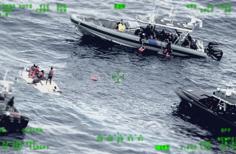 Rescue craft arrive on scene after a migrant vessel capsized north of Desecheo Island, Puerto Rico May 12, 2022 in a still image from surveillance aircraft video. (photo credit: UNITED STATES COAST GUARD/HANDOUT VIA REUTERS)
