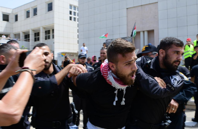  Israel Police arrest Arab protesters at Nakba Day rally at Tel Aviv University, May 15, 2022 (credit: AVSHALOM SASSONI/MAARIV)
