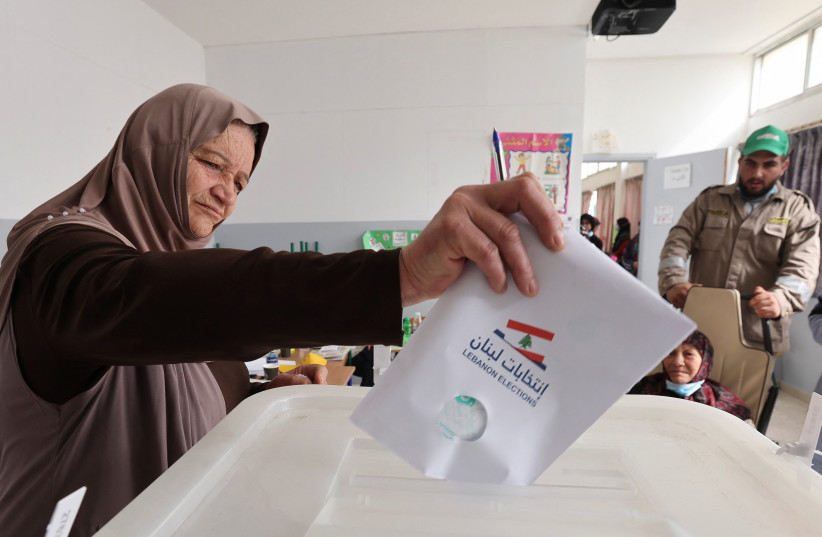  A woman casts her vote in the Lebanese parliamentary election, at a polling station in Ainata, southern Lebanon May 15, 2022. (credit: AZIZ TAHER/REUTERS)