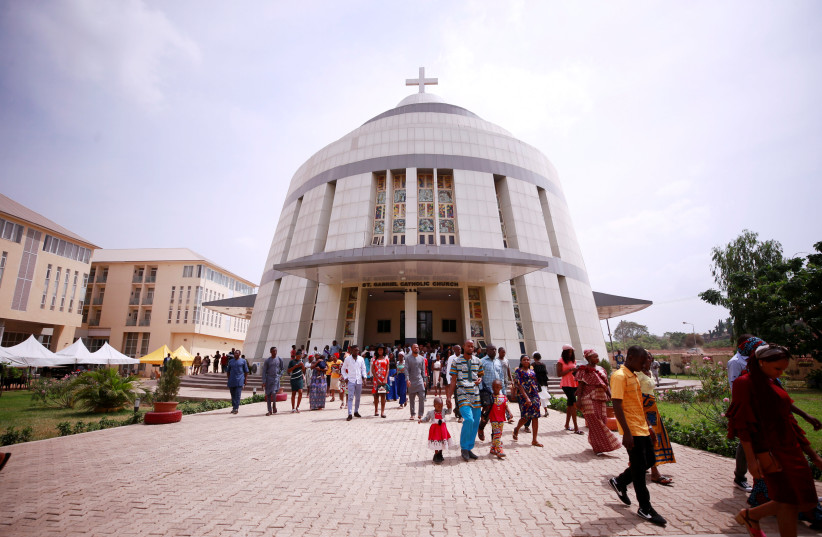 Christian worshippers leave church after a mass at the St Gabriel Catholic church, following the outbreak of the coronavirus disease (COVID-19), in Abuja, Nigeria March 22, 2020.  (credit: REUTERS/AFOLABI SOTUNDE)