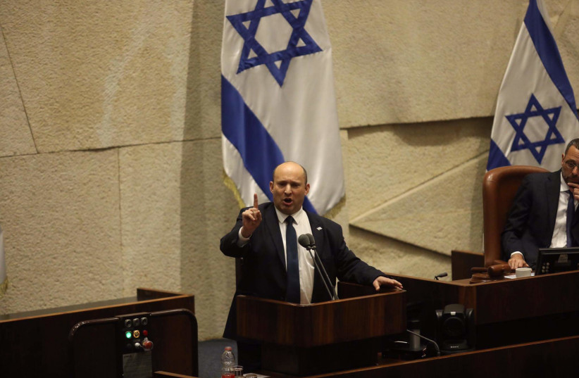  Israeli Prime Minister Naftali Bennett gestures at the Knesset in Jerusalem, on May 16, 2022. (credit: MARC ISRAEL SELLEM/THE JERUSALEM POST)