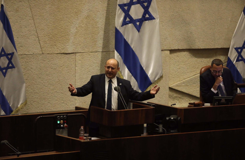  Israeli Prime Minister Naftali Bennett gestures at the Knesset in Jerusalem, on May 16, 2022. (credit: MARC ISRAEL SELLEM/THE JERUSALEM POST)