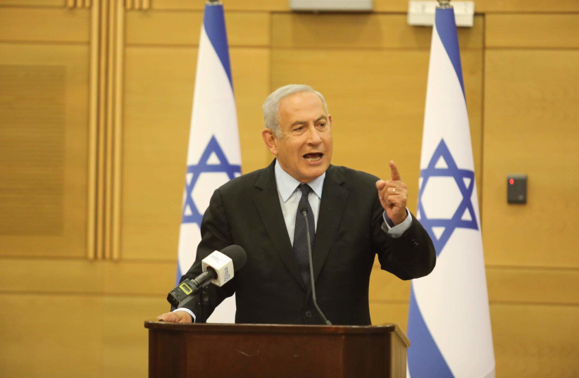  Israeli opposition leader Benjamin Netanyahu gestures at the Knesset in Jerusalem, on May 16, 2022. (photo credit: MARC ISRAEL SELLEM/THE JERUSALEM POST)