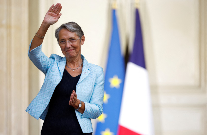 Newly-appointed French Prime Minister Elisabeth Borne gestures as she attends a handover ceremony in the courtyard of Hotel Matignon in Paris, France, May 16, 2022.  (credit: REUTERS/CHRISTIAN HARTMANN)
