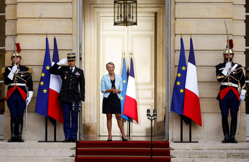  Newly-appointed French Prime Minister Elisabeth Borne attends a handover ceremony in the courtyard of Hotel Matignon in Paris, France, May 16, 2022.  (credit: REUTERS/CHRISTIAN HARTMANN)