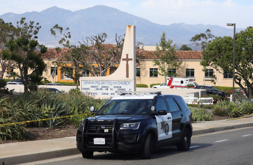  A police car is seen after a deadly shooting at Geneva Presbyterian Church in Laguna Woods. (photo credit: REUTERS/DAVID SWANSON)