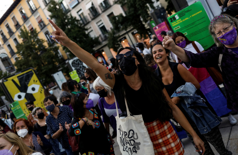 Women take part in a pro-abortion rights demonstration to mark International Safe Abortion Day, in Madrid, Spain, September 28, 2021. Picture taken September 28, 2021. (credit: REUTERS/SUSANA VERA)