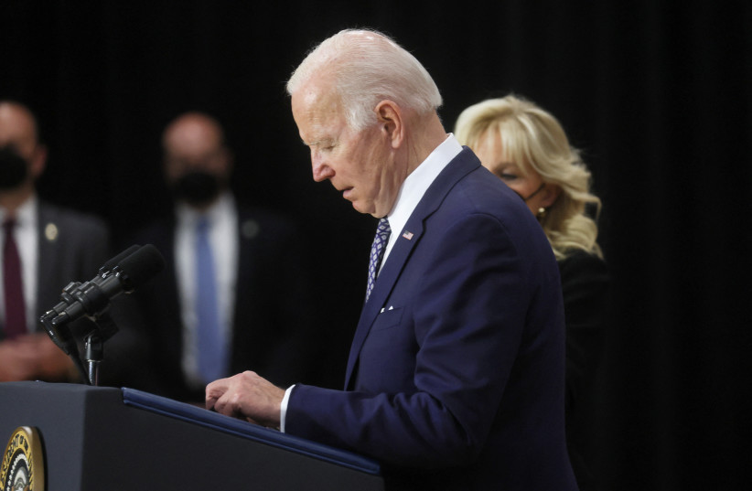  US President Joe Biden delivers remarks as first lady Jill Biden stands next to him, after paying respects and meeting with victims, family, first responders and law enforcement who were affected by the mass shooting committed by a gunman authorities say was motivated by racism. (photo credit: REUTERS/LEAH MILLIS)