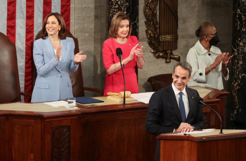  Greek Prime Minister Kyriakos Mitsotakis delivers an address to a joint meeting of Congress as Vice President Kamala Harris and House Speaker Nancy Pelosi (D-CA) clap hands, inside the House Chamber of the US Capitol in Washington, US, May 17, 2022. (photo credit: REUTERS/Julia Nikhinson)