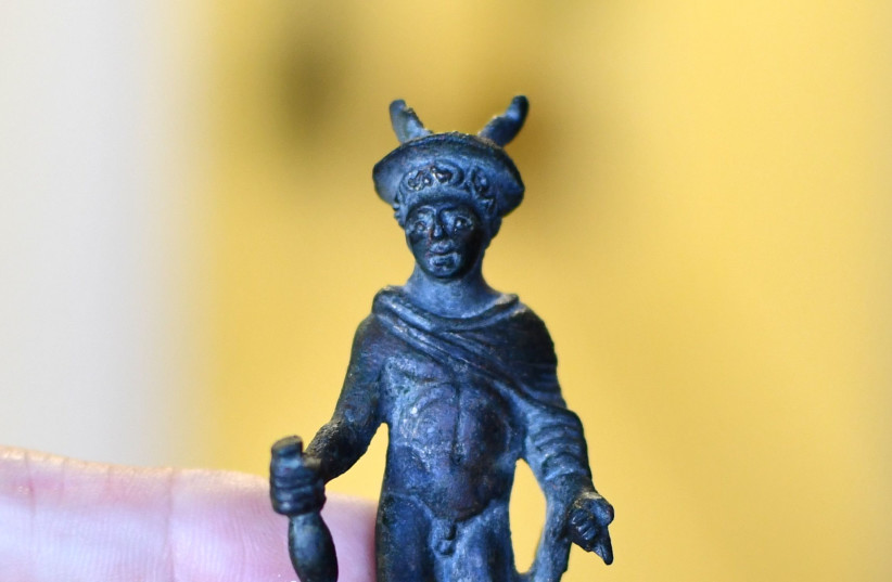  Statue of the Greek god Hermes found in the home of an illegal antiquities dealer in Modi'in.  (credit: YOLI SCHWARTZ/IAA)