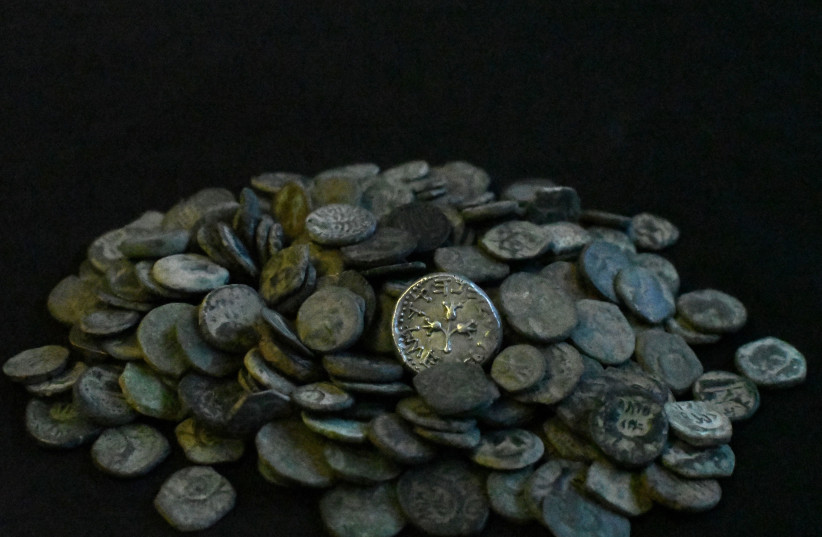  Some of the coins seized at the home of an illegal antiquities dealer in Modi'in.  (credit: YOLI SCHWARTZ/IAA)