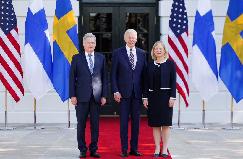  US President Joe Biden poses for a photo as he welcomes Sweden's Prime Minister Magdalena Andersson and Finland's President Sauli Niinisto at the White House in Washington, US, May 19, 2022. (photo credit: REUTERS/EVELYN HOCKSTEIN)
