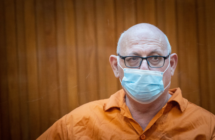  Shimon Cooper who was convicted of murdering his first and his third wife and serving two life sentences is brought for a court hearing at the Supreme Court in Jerusalem, January 3, 2021.  (photo credit: YONATAN SINDEL/FLASH90)