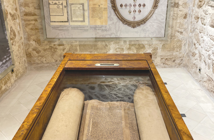  A TORAH AND letters of protection from kings of Morocco at Bayt Dakira in Essaouira.  (credit: Lahav Harkov)