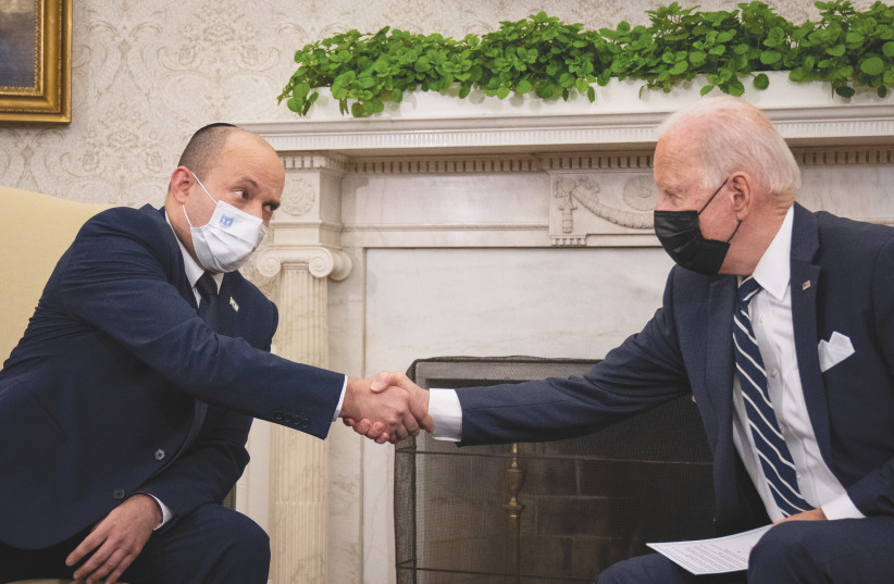  US PRESIDENT Joe Biden greets Prime Minister Naftali Bennett in the Oval Office at the White House last year. Would Bennett benefit from a Biden visit to Israel? (credit: SARAHBETH MANEY/POOL VIA REUTERS)