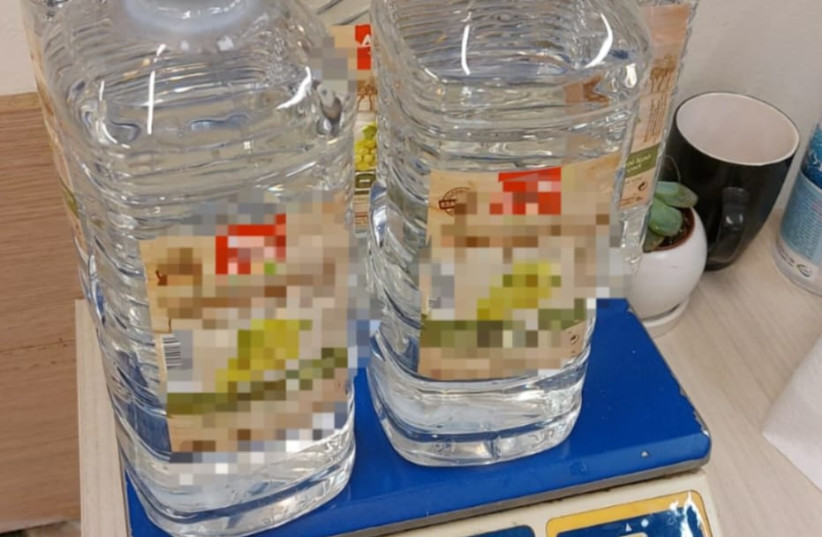  Bottles of GBL rape drug disguised as mineral water. (credit: ISRAEL POLICE SPOKESPERSON'S UNIT)