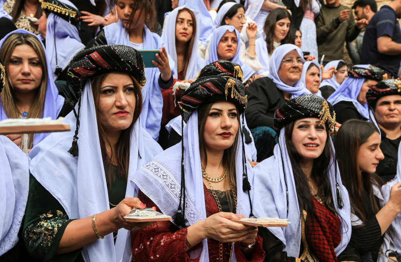  Iraqi Yazidis attend a ceremony to celebrate the Yazidi New Year at Lalish temple in Shekhan District in Duhok province, Iraq April 19, 2022. (photo credit: REUTERS/ARI JALAL)