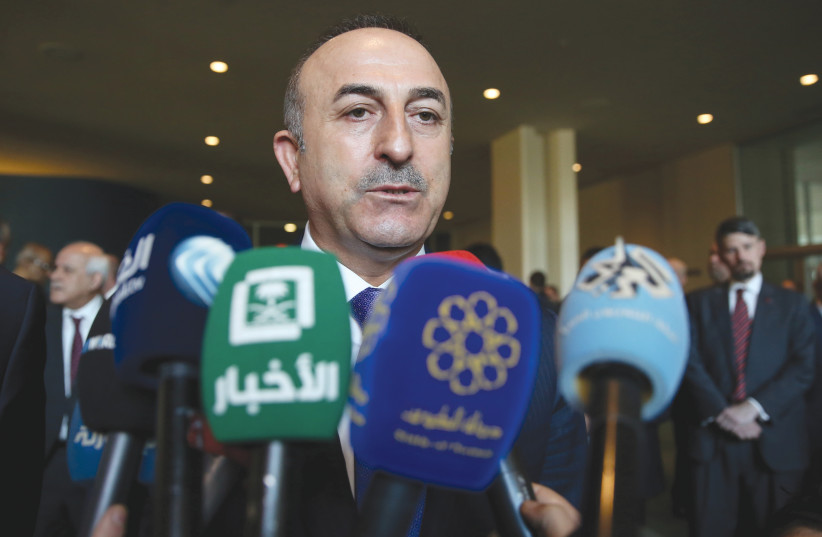  TURKISH FOREIGN MINISTER Mevlut Cavusoglu speaks to the press after a UN General Assembly emergency session on the US decision to recognize Jerusalem as Israel’s capital, in 2017. The renewal of a diplomatic-strategic Israel-Turkey dialogue is in its infancy. (photo credit: AMIR ALFIKY/REUTERS)