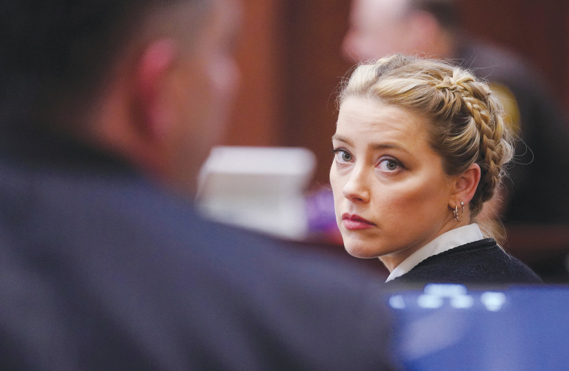  AMBER HEARD looks on during ex-husband Johnny Depp’s defamation trial against her, at a court in Virginia, last week.  (photo credit: Shawn Thew/Reuters)