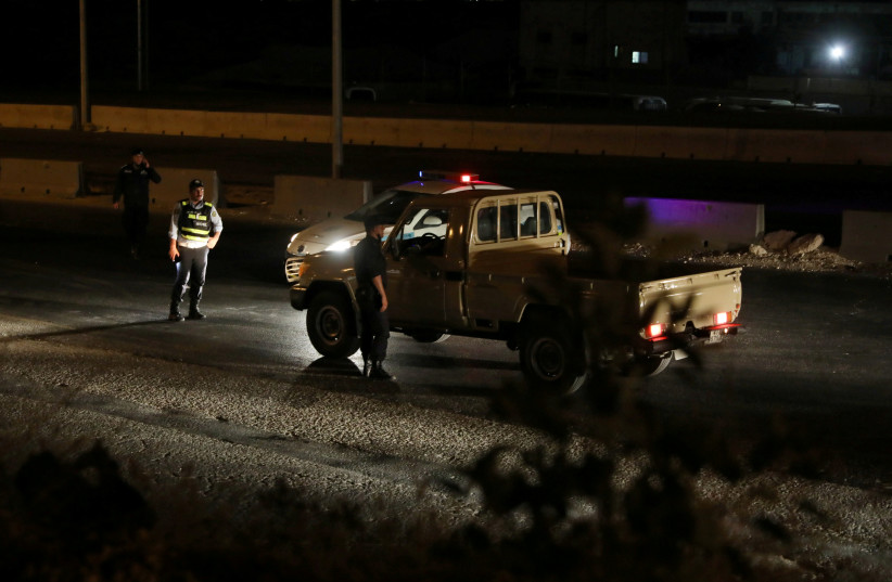 Jordanian police check point close the highway between Jordanian capital of Amman and the city of Zarqa, after of large explosions at a Jordanian army base outside the city of Zarqa on the northeastern edge of capital Amman, Jordan, September 11, 2020. (photo credit: REUTERS/MUHAMMAD HAMED)