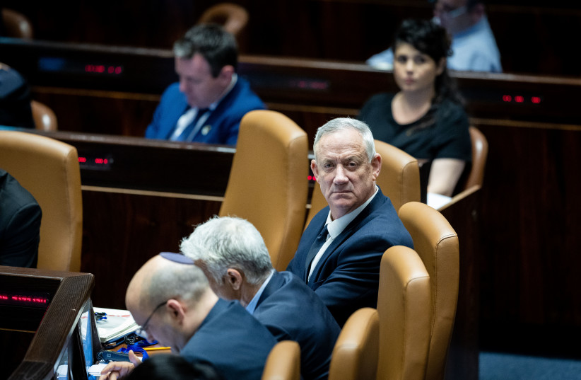  Israeli prime minister Naftali Bennett, Foreign Minister Yair Lapid and Defense Minister Benny Gantz attend a plenum session in the assembly hall of the Knesset, the Israeli parliament in Jerusalem on May 23, 2022.  (credit: YONATAN SINDEL/FLASH90)