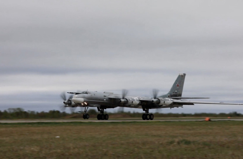  Russian Tu-95 strategic bomber takes off during Russian-Chinese military aerial exercises to patrol the Asia-Pacific region, at an unidentified location, in this still image taken from a video released May 24, 2022. (credit: Russian Defence Ministry/Handout via REUTERS)