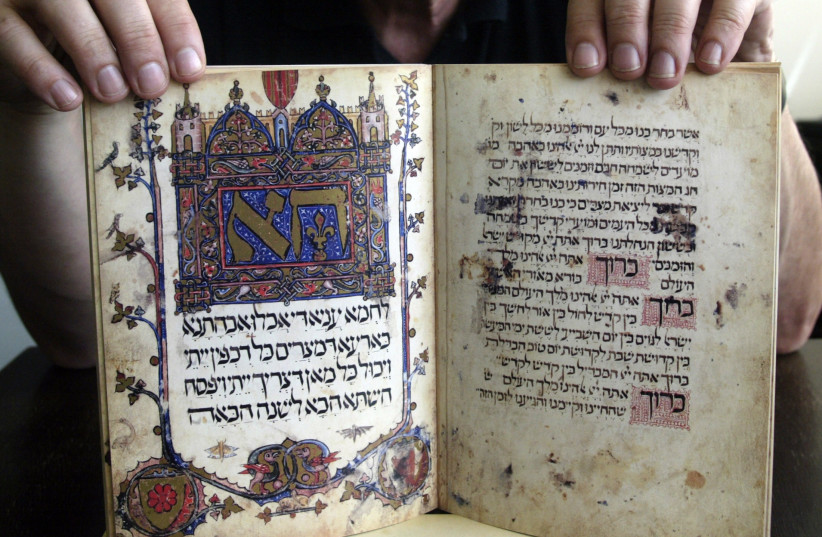  A Jewish publisher in Sarajevo presents May 24, 2006 a luxurious replica of the Haggadah, a 600-year-old Jewish manuscript that survived the Spanish inquisition, World War Two and Bosnia's 1992-95 war. (photo credit: REUTERS/DANILO KRSTANOVIC)
