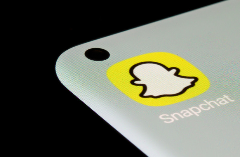  Snapchat app is seen on a smartphone in this illustration taken, July 13, 2021.  (credit: REUTERS/DADO RUVIC/ILLUSTRATION)