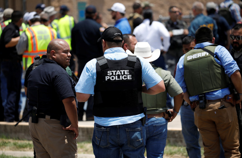  Law enforcement personnel guard the scene of a suspected shooting near Robb Elementary School in Uvalde, Texas, US May 24, 2022 (credit: REUTERS/MARCO BELLO)