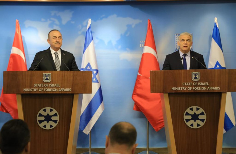  Turkish Foreign Minister Çavuşoğlu makes a joint statement with Foreign Minister Yair Lapid. (photo credit: ASSI EFRATI/GPO)